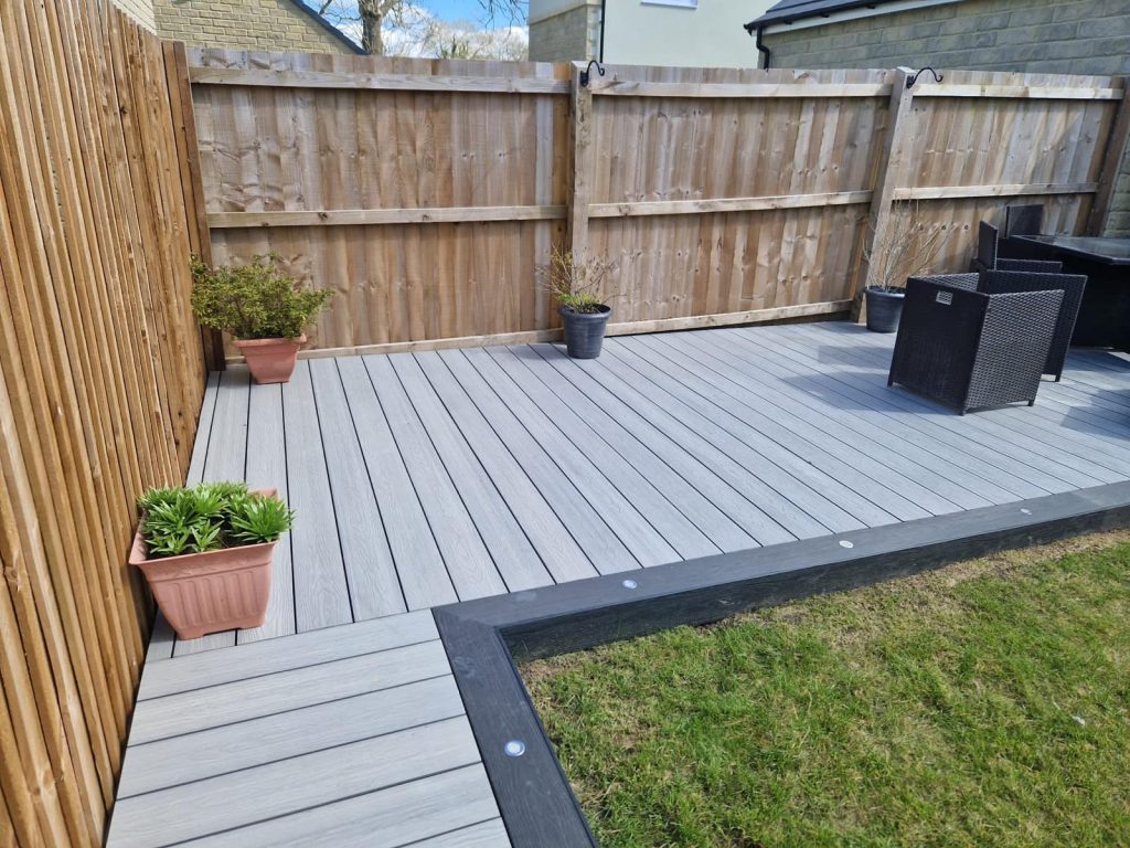 Wrap-around light grey composite decking with charcoal border