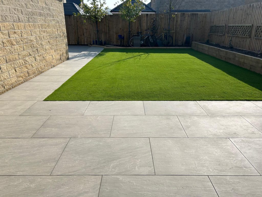Artificial grass lawn with porcelain patio in Clitheroe